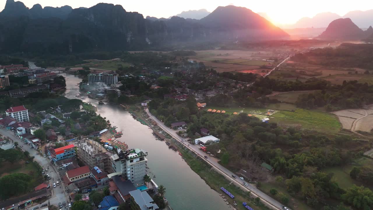 Aerial sunset view Vang Vieng village town north of Vientiane, on the Nam Song River in Laos, travel destination in south east Asia