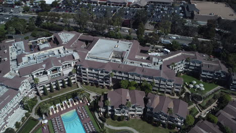 cinematic drone shot of a luxury beachside resort in laguna beach, california. shot in 4k.