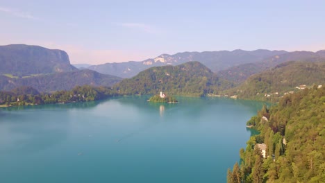 aerial clip over lake bled slovenia towards bled island a popular tourist destination in the julian alps