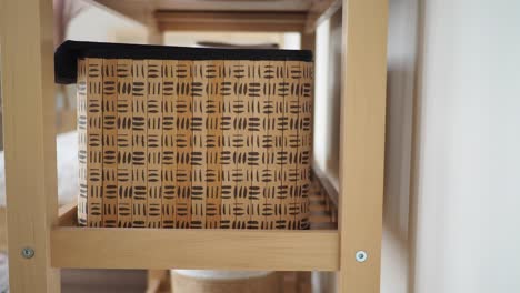 wooden shelf with decorative bamboo storage basket