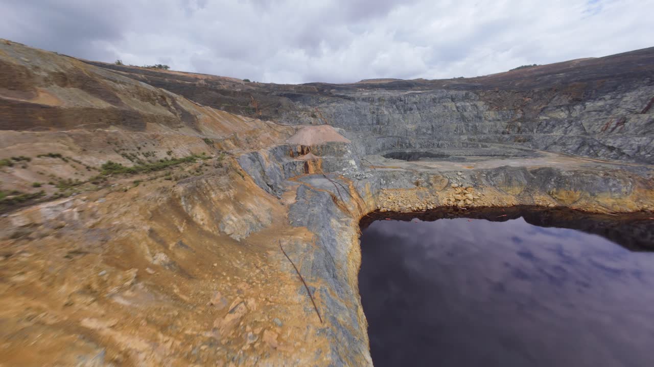 Contentious open pit mining operation of Barrick Pueblo Viejo. FPV drone view