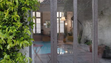 slow orbiting shot of a private pool within a patio of a villa in baillargues