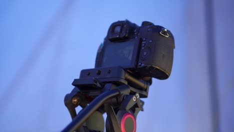 close-up of a compact camera with tripod taking a burst shot