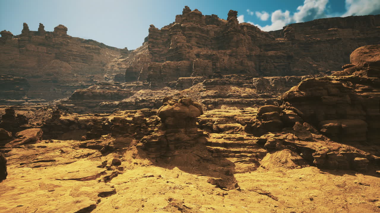Rocky landscape showcasing rugged cliffs under bright blue sky