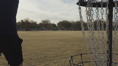 rear view of a disc golf forehand throw