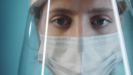 Female-Doctor-in-Face-Shield-and-Mask-Posing-for-Camera