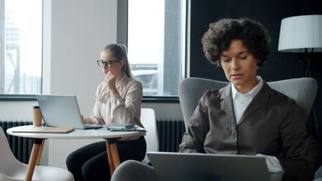 two women working at a co-working space
