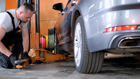 mechanic working on a car in an auto repair shop