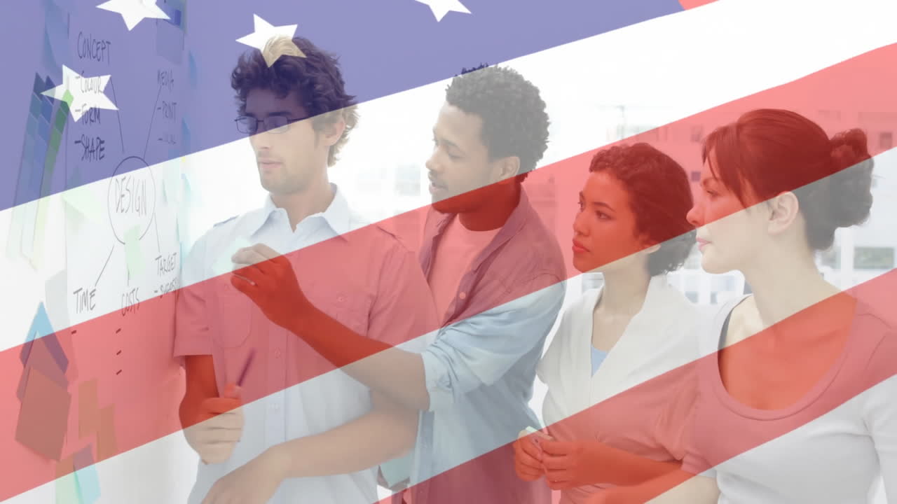 American flag animation over diverse team collaborating on whiteboard in office