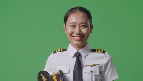 smiling female pilot in uniform