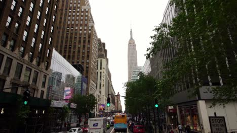 new york city manhattan street with view of empire state building moving shot