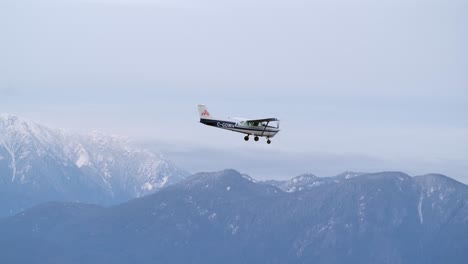 air to air footage of airplane flying with mountain background