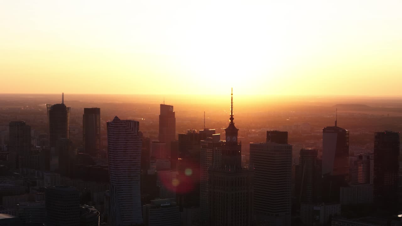 Warsaw cityscape at golden hour sunset, droneview