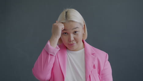 woman in pink blazer