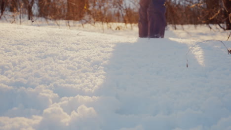 Carefree-Child-Trips-Out-On-Snow-Covered-Path-1