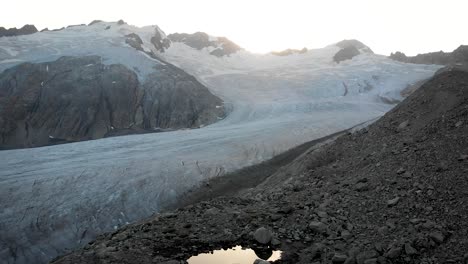 aerial flight alongside the gauli glacier in the bernese oberland region of the swiss alps with a panning view over the full glacier