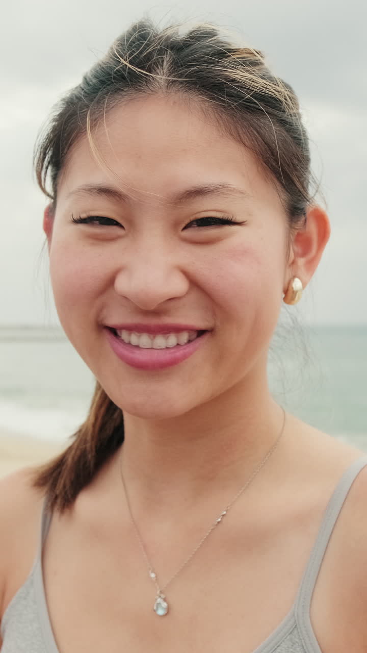 Smiling Asian Woman on Beach