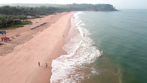 goa sinquerim beach drone bird's eye view drone coming blue goa beach