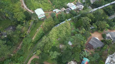 aerial of the train riding through rural sri lanka