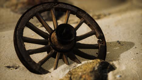 Large-wooden-wheel-in-the-sand