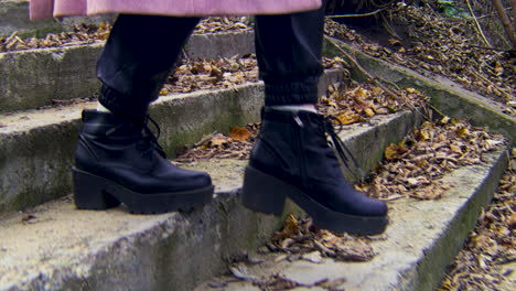 woman walking up outdoor stairs