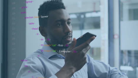 animation of data processing over african american businessman talking on smartphone