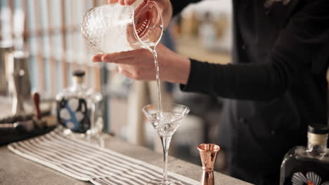 bartender preparing a martini