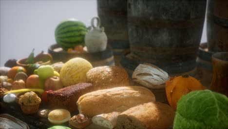 mesa de comida con barriles de vino y algunas frutas, verduras y pan