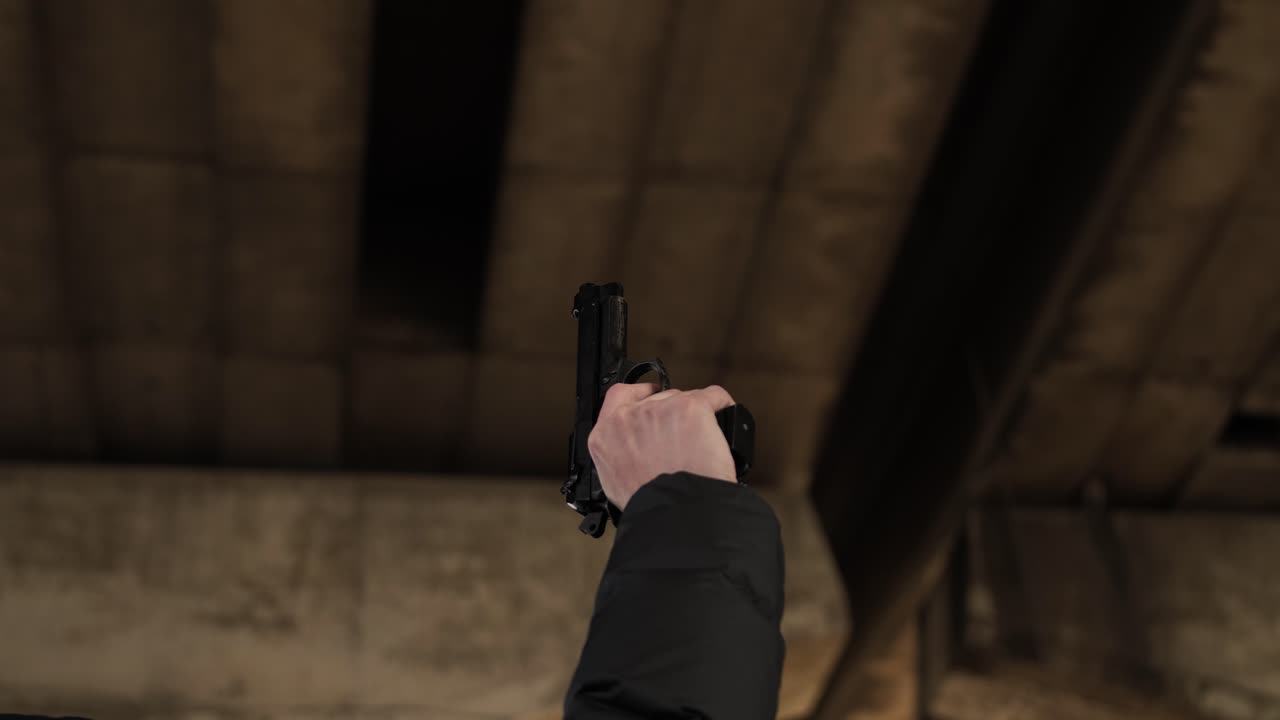 Slow-motion footage of an alarm pistol being fired into the air under a viaduct