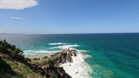 scenic ocean view with waves hitting rocky shore