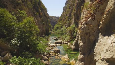 River,-green-nature-and-rocks,-people-floating-in-river