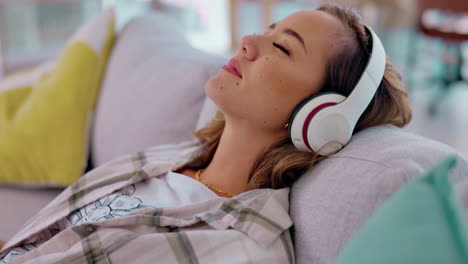 Relax,-headphones-and-woman-on-couch-for-music