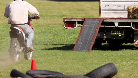 motorcyclist skillfully maneuvers over ramps and obstacles.