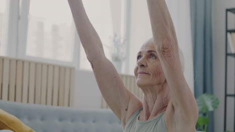 senior woman practicing yoga at home