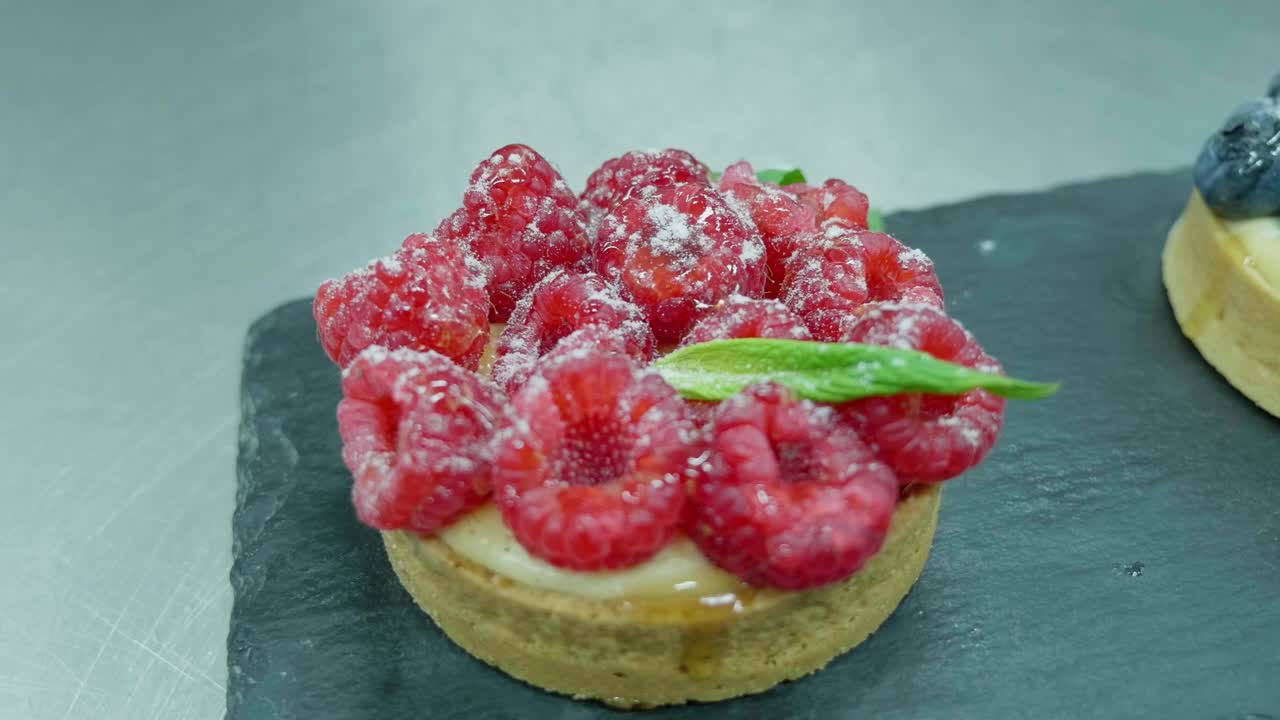 Raspberries custard mini cake with mint leaves