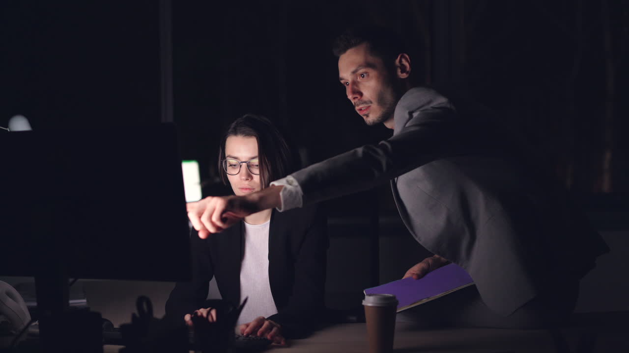 Business colleagues working late into the night