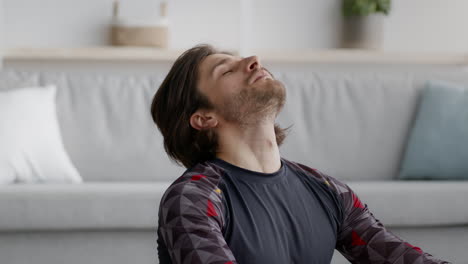 man stretching at home