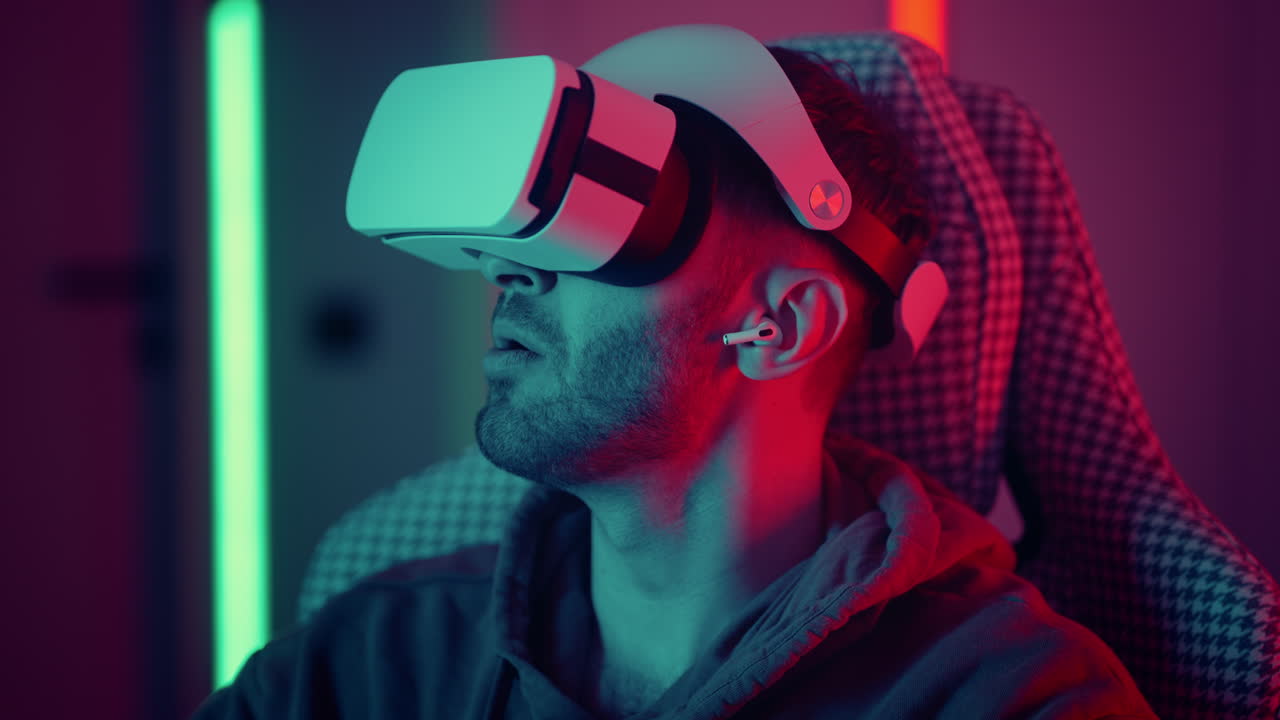 Man watching movie using virtual reality glasses. man makes swiping and touching moves with hands playing VR game. High quality 4k footage