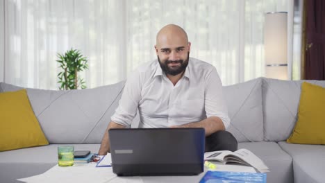 home office worker man winks at camera.