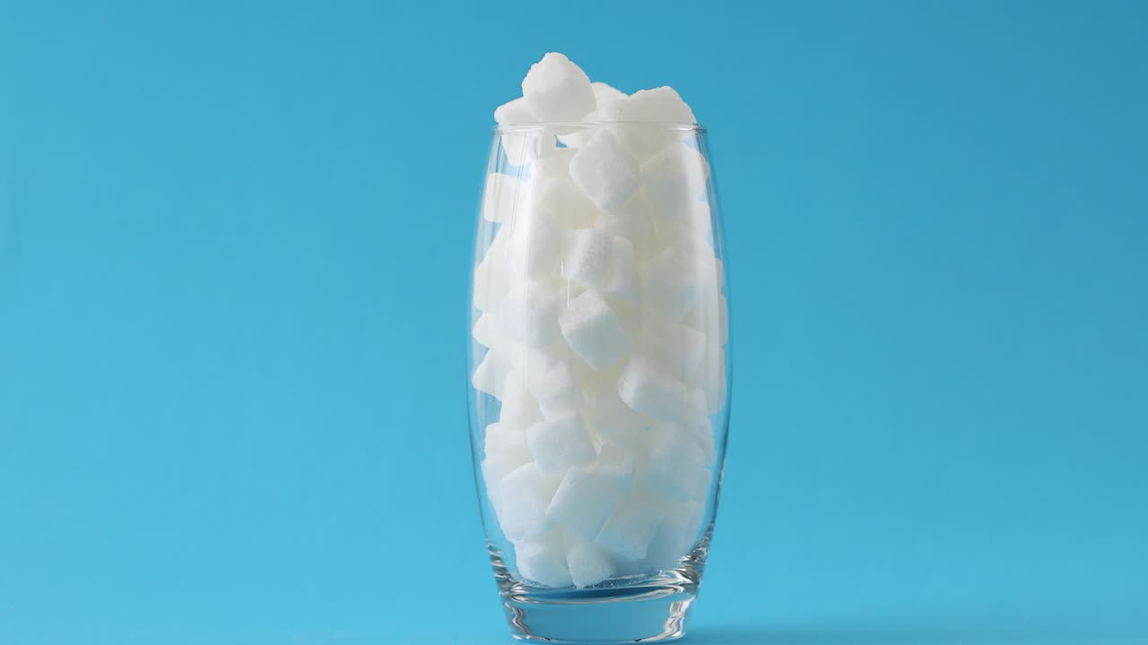 Glass full of sugar cubes