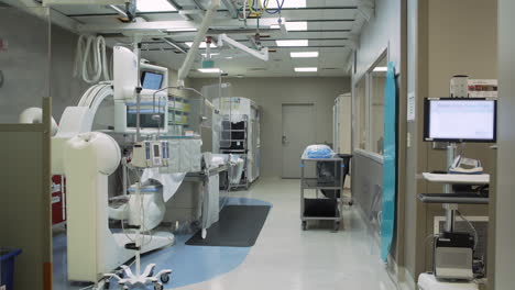 doors opening to hospital room with medical equipment - slow motion - 4k uhd