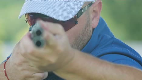 sportsman shoots from a double-barreled shotgun, a sports field for a shooting test is shooting at flying skeet