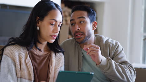 couple, planning and tablet in new house