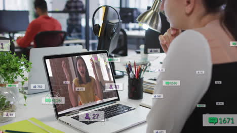 using laptop for video conferencing, person with animation of social media icons