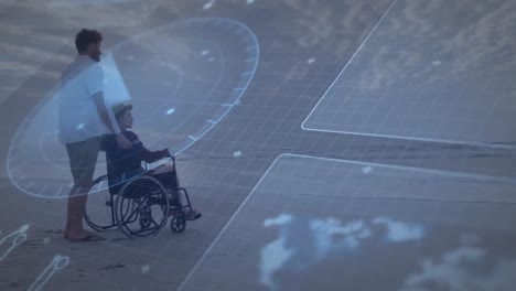 animation of data processing over caucasian man with boy in wheelchair on beach