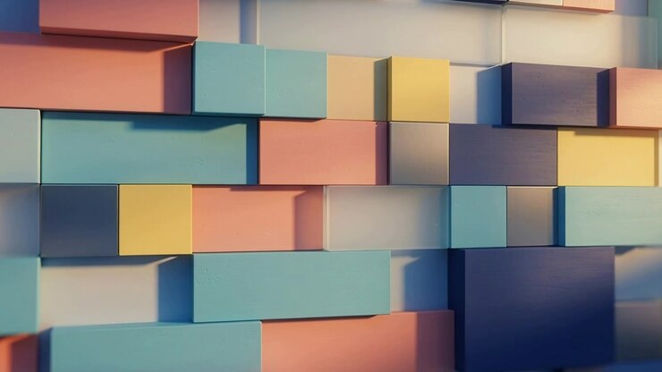 Pulling camera closer, shifting focus and revealing pastel block wall, showing depth in studio