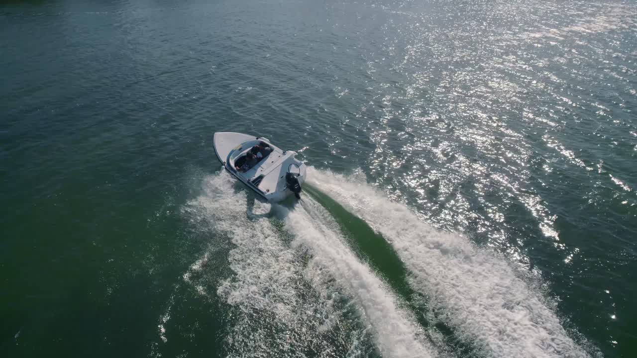 Drone tracking luxury yacht cruising in exotic turquoise water of Balearic Island, Spain