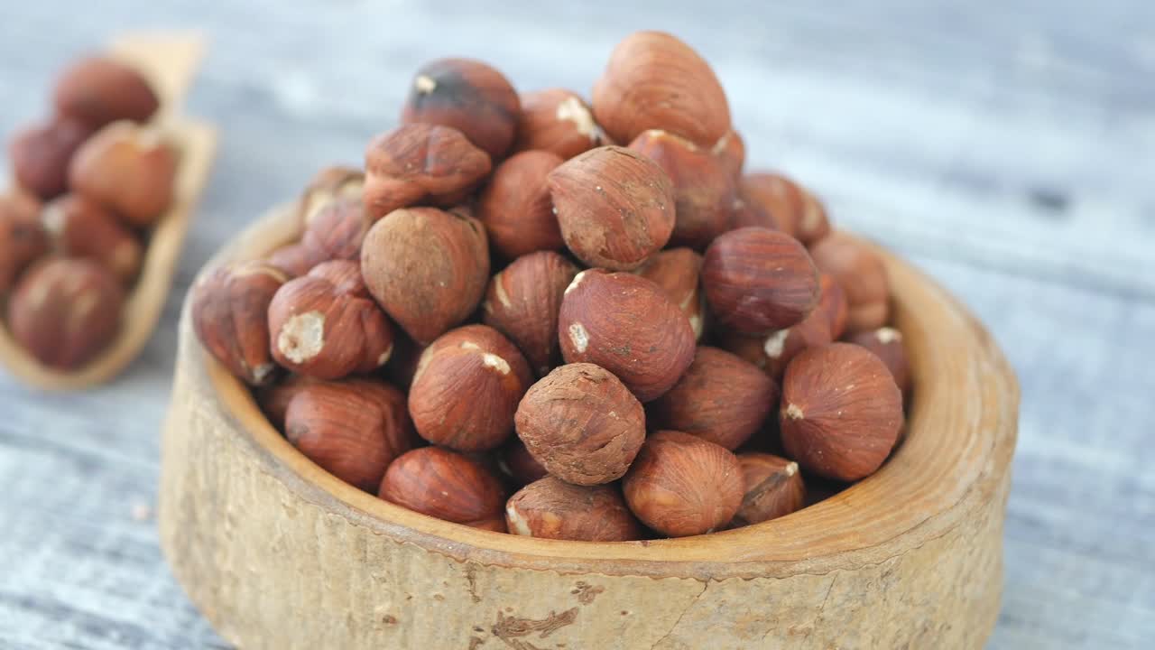 Hazelnuts in a wooden bowl