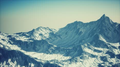 aerial view of the alps mountains in snow