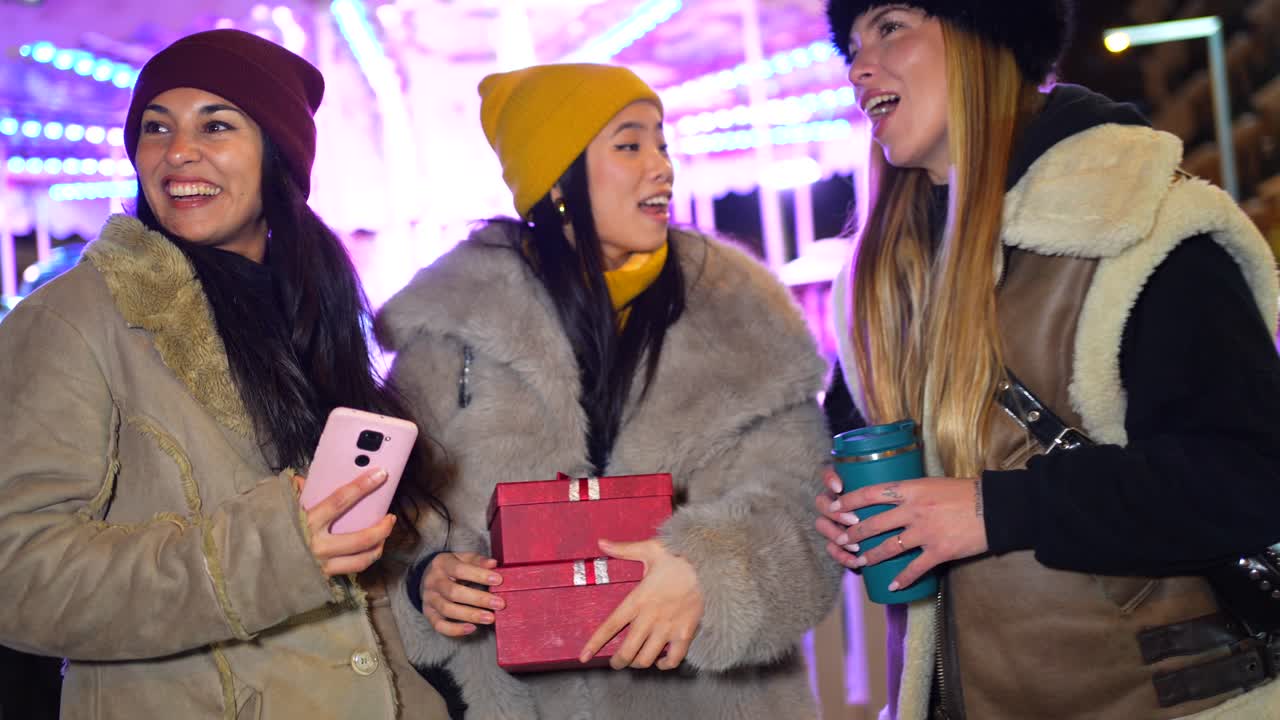 A group of friends celebrating outdoors at night